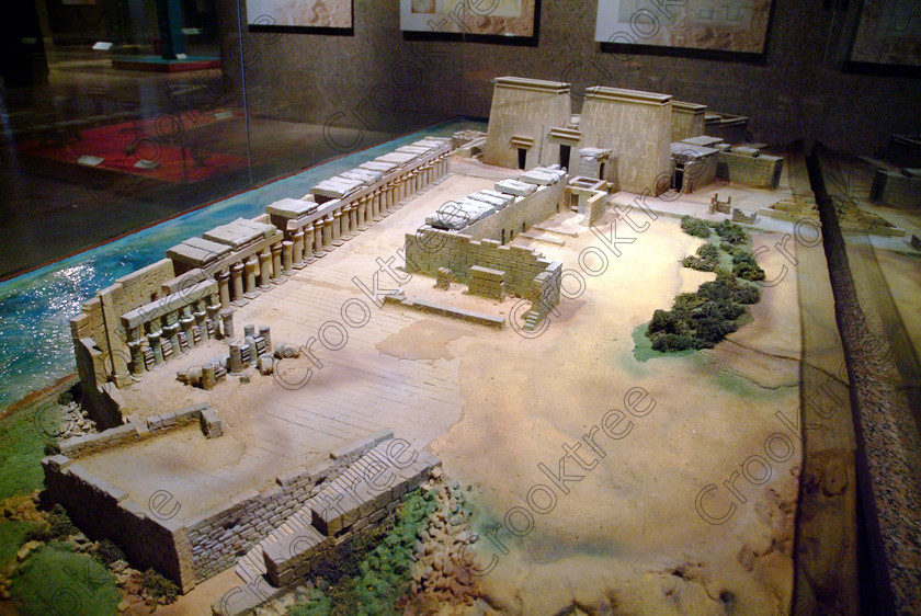 Aswan Museum Philae Model EG052967JHP 
 Aswan Egyptian Nubian Museum model of Philae Temple before relocation with the noticeable omission of Trajan's Kiosk and inside a modern airconditioned building whose foundations were laid in 1986, opened in 1997 and organised through UNESCO. Very low artificial light makes general photography difficult as well as affecting accurate colour balance. This now appears to be the only museum in Egypt where photography is still allowed although it is not easy as the ambient lighting is extremely subdued for conservation reasons. 
 Keywords: Egypt, Egyptian, Aswan, Nubian, Nubia, Museum, exhibit, Philae, Temple, model, prior, relocation, inside, interior, ancient, landscape