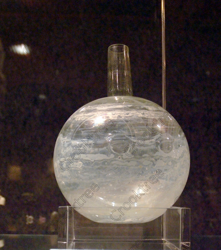 Aswan Nubian Museum Glassware EG052960JHP 
 Aswan Egyptian Nubian Museum example of glassblowing and design from Nubia in this modern building whose foundations were laid in 1986, opened in 1997 and organised through UNESCO. Very low artificial light makes general photography difficult as well as affecting accurate colour balance. This now appears to be the only museum in Egypt where photography is still allowed although it is not easy as the ambient lighting is extremely subdued for conservation reasons. 
 Keywords: Egypt, Egyptian, Aswan, Nubian, Nubia, Museum, exhibit, glass, bottle, glassware, design, local, etched, elaborate, inside, interior, ancient, upright